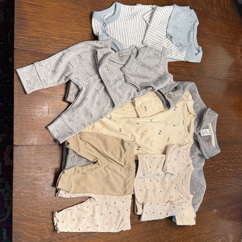 10 piece lot of baby clothes size 0-12 months, never worn! 8 pcs are Carters!